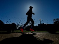 A man goes for an early morning run around the south end of New Bedford.