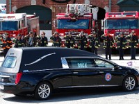 Station 9 firefighters salute the hearst carrying New Bedford firefighter Matthew Forand who died while on duty.  Station 9 was firefighter Forand's base.