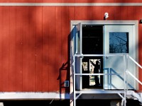 A worker is seen through the open door of the temporary trailers being installed at Umass Dartmouth to house professors and students during renovations to the Group 1 building.