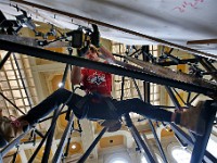 Nicholas Chrusten hangs between supporting beams as he constructs the walls of the soon to open Boulder Union climbing gym inside the former New Bedford Institute for Savings historic building on Union Street in downtown New Bedford.