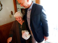 Maria Amaral is overcome with emotion upon realizing that Mayor Jon Mitchell is the one delivering her meal today as part of the Coastline Elderly's Meals on Wheels program.  Mrs. Amaral is blind and at first was not aware that her meal was being delivered by a different person today.