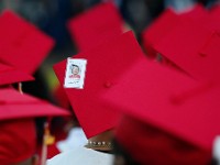 Derek Ramy has a card with his grandmother's name attached to his mortarboard during the 2024 New Bedford High School graduation.  His grandmother Carol Mendes passed away in December 2023.