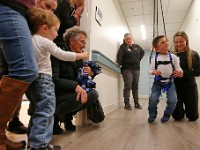 Austin Carrita, 2, points at his brother Grayson Ferreira, 6, who was diagnosed with cerebral palsy at birth, as he walks alone with the assistance of a suspension system installed at the new Southcoast Health Pediatric Rehabilitation Program building on Acushnet Avenue in New Bedford.  Next to himErica Keisling, physical therapist, encourages Grayson to walk on his own.