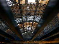 A man walks down the steps which wind around the outside of the historic elevator at New Bedford City Hall.