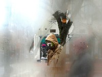 A man tries to keep his face warm as he makes his way across a gap in the steamed windows of No Problemo in downtown New Bedford on a frigid morning.