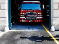 A firefighter walks past the entrance to where the new Ladder 1 truck is parked at Station 2 in New Bedford.