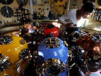 Karen Wallace, manager, aligns the blue colored diving helmet for sale at Moby Dick Nauticals in downtown New Bedford.