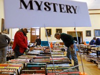 People browse through the books for sale at the annual Friends of Elizabeth Taber Library book sale held at the Marion Music Hall.  The book sale will happen on May 10th and May 11th.