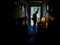 A woman browses the items for sale at the Firt Unitarian Thrift Shop on 8th Street in New Bedford.