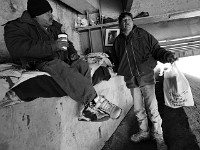 Lucio, left, a mechanic who cant find work, shares the spaces under the overpass with Jefferey who since injuring his ankle has not been able to work at the only job he knows how to do, fishing.  Three men's recent change in fortunes have forced them to make their home under the 195 overpass due to circumstances that they could not have imagined. No living homeless, they live on a day to day basis hoping for a change in their luck.