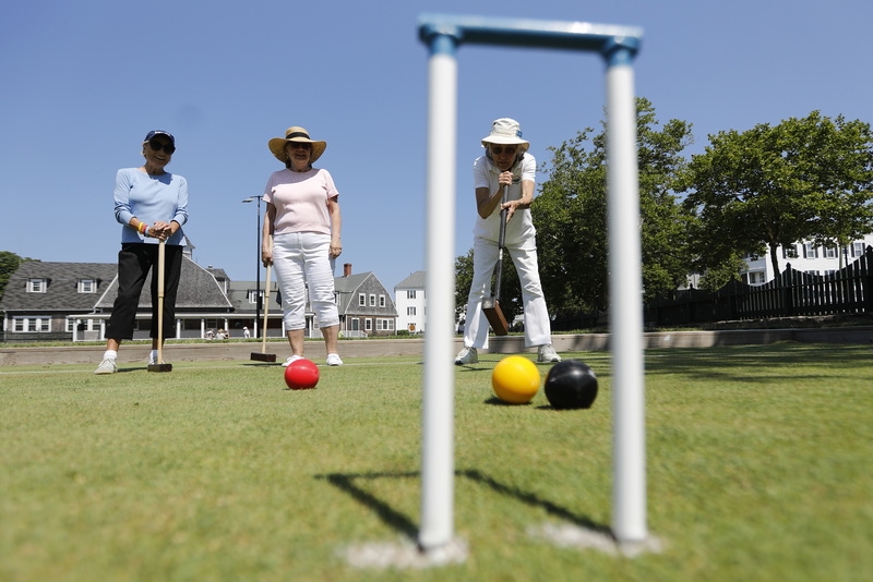 Ruth Nicolaci sends her ball toward the wicket during a game of croquet at the historic Bowling Greens at Hazelwood Park in the south end of New Bedford, MA.  The original bowling greens were constructed in 1919 by local mill owners who were originally from Manchester, England.  PHOTO PETER PEREIRA