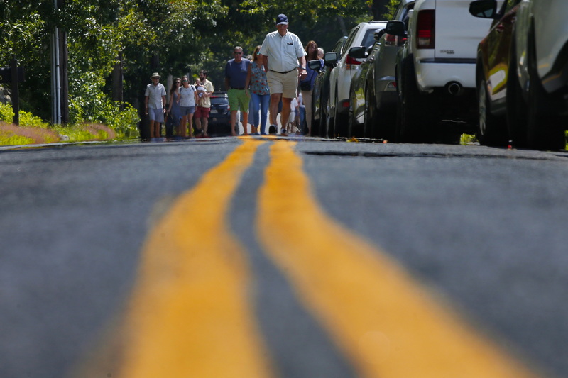 People make the pilgrimage to the annual Allens Neck Meeting Clambake, by walking down Allens Neck Road in Dartmouth, MA.  PHOTO PETER PEREIRA