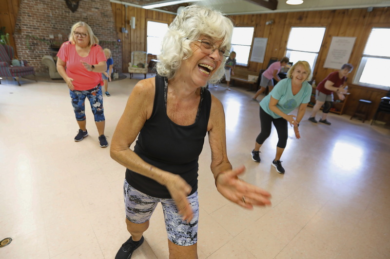 Carla Paparalla is all smiles, as she and other participate in the weekly Zumba session at the Buttonwood Senior Center in New Bedford, MA.  PHOTO PETER PEREIRA