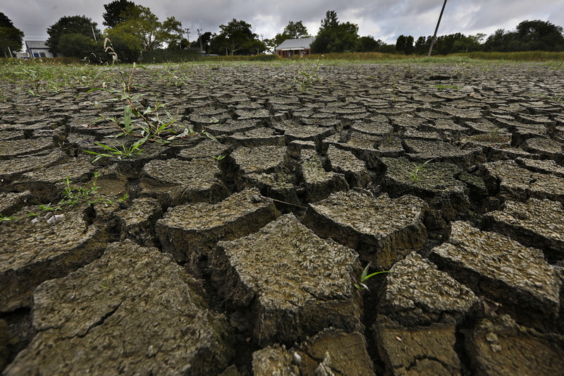 Normally filled with water, the Victory Park Pond on Brock Avenue in the south end of New Bedford, MA has run completely dry thanks to the extreme heat that has covered the region. PHOTO PETER PEREIRA