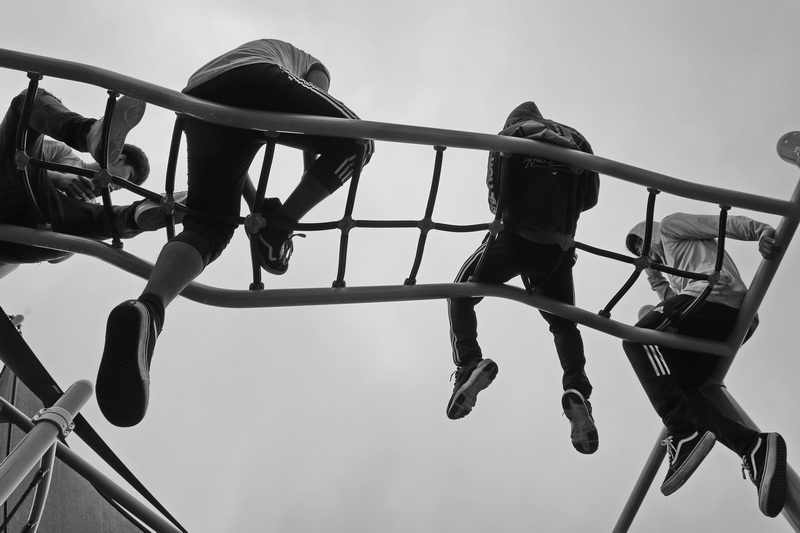 Four young men wait for the Fairhaven bridge to open, by hanging out at Noah's Place Playground on Pope's Island in New Bedford, MA.  PHOTO PETER PEREIRA