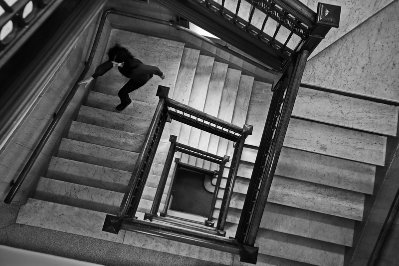 A woman makes her way up the marble staircase at New Bedford City Hall.  PHOTO PETER PEREIRA