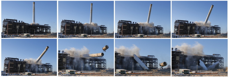 Costello Dismantling crews look on as the chimney of the former Eversource plant on the New Bedford, MA waterfront is toppled with the use of explosives. PHOTO PETER PEREIRA