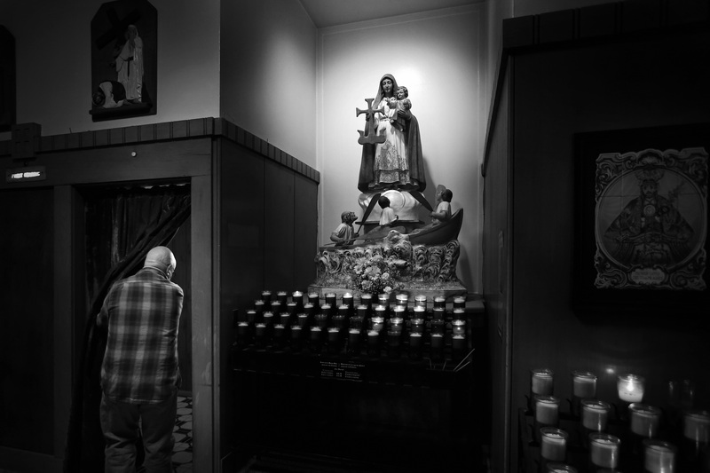 A man walks into the confession booth at Our Lady's Chapel in downtown New Bedford, MA.  PHOTO PETER PEREIRA