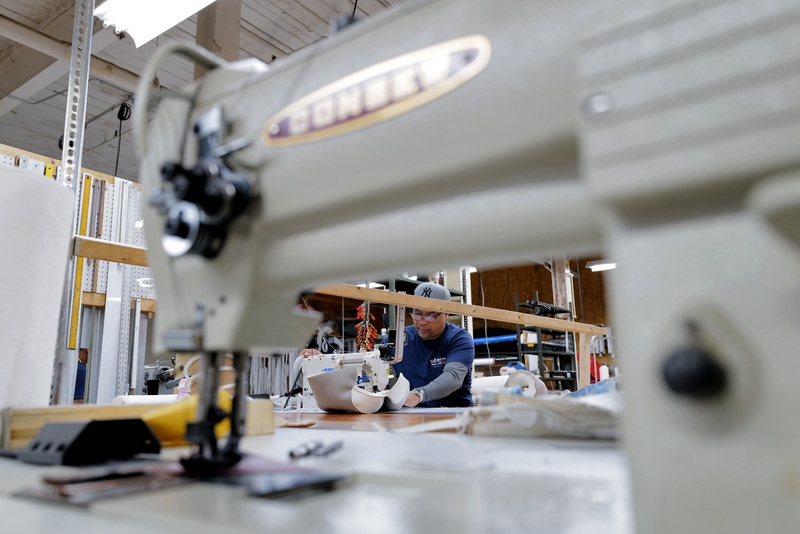 Cesar Abreu sews a section of a boat seat he is making at Cesar Marine Canvas & Upholstery on Harbor Street in New Bedford, MA. PHOTO PETER PEREIRA