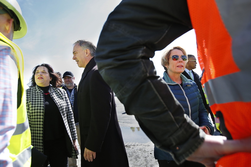 New Bedford Mayor Jon Mitchell and Massachusetts Lt. Gov. Kimberley Driscoll converse,  left, while Governor Maura T. Healey speaks with some of the site authorities during her stop to the New Bedford Marine Commerce Terminal where she highlight climate-related investments in their FY24 proposal.  PHOTO PETER PEREIRA