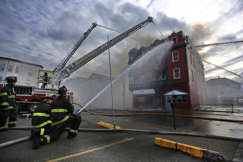 New Bedford firefighters fight Acushnet Avenue apartment building fire. PHOTO PETER PEREIRA