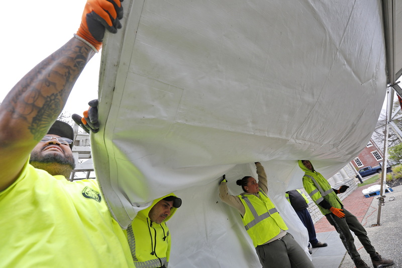 New Bedford DPI's, Carlos Medina, Abilio Andre, Andrea DeVasconcelos and Emanizael Nieves-Amado erect the summer activities tent at Custom House Square in downtown New Bedford, MA. PHOTO PETER PEREIRA