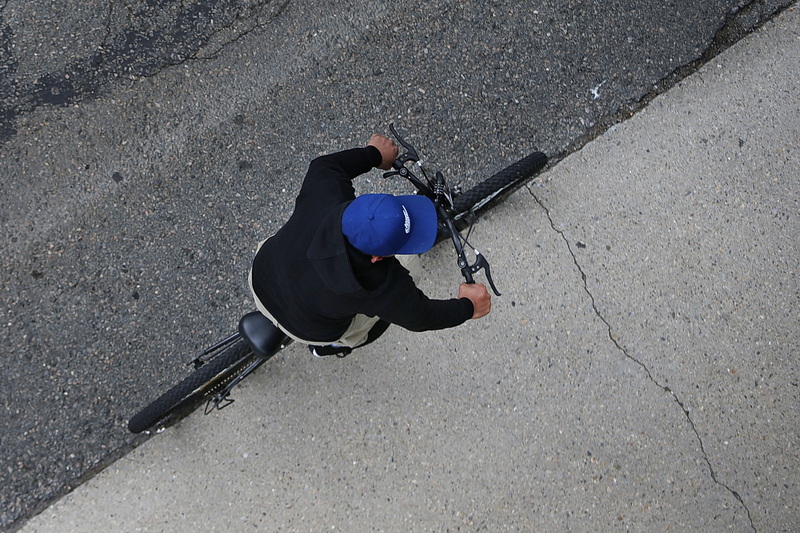 A man rides his bicycle up Elm Street in New Bedford, MA as seen from the top of the Elm Street garage. PHOTO PETER PEREIRA