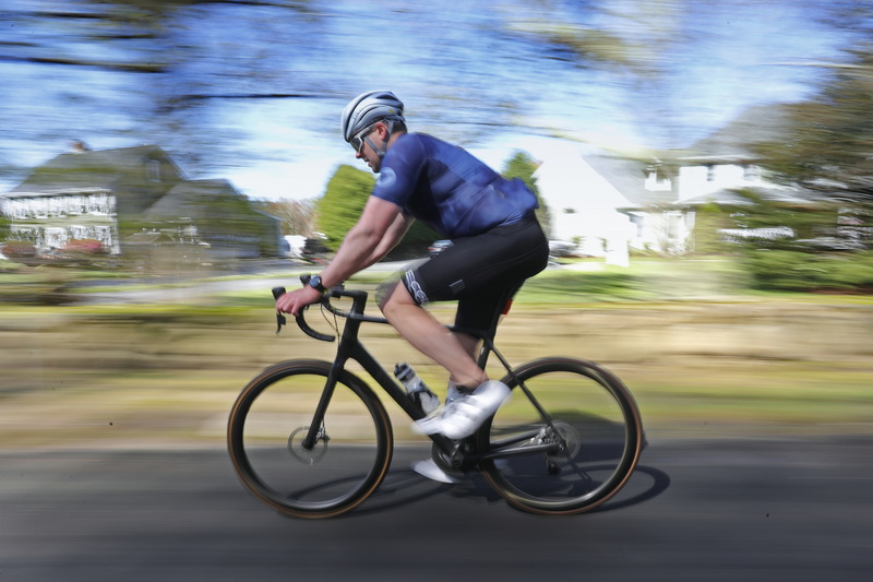 Arthur Hegarty makes his way up Smith Neck Road in Dartmouth, MA for a morning bike ride. PHOTO PETER PEREIRA