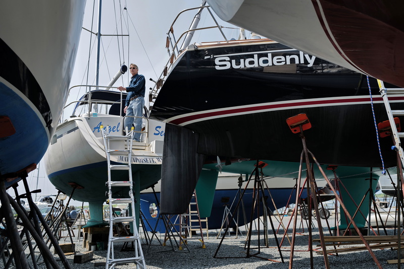 Phil Piwowarski looks out from his boat stored at the Mattapoisett Boatyard as he prepares to put it in the water.  Mr. Piwowarski's car was consumed by fire when a fire ripped through the yard last year. PHOTO PETER PEREIRA