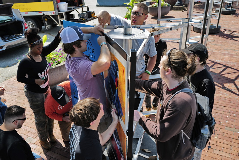 New Bedford Voc Tech students install DATMA's 2023 exhibition titled 