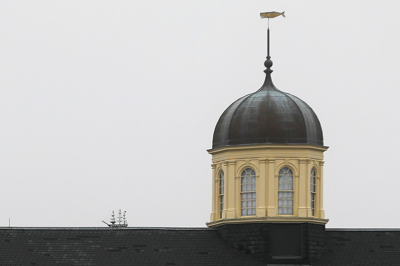 The whale ship weathervane of the Seamen's Bethel seemingly sails across the roofline of the New Bedford Whaling Museum being chased by the whale weathervane atop the museum's iconic cupola.  PHOTO PETER PEREIRA