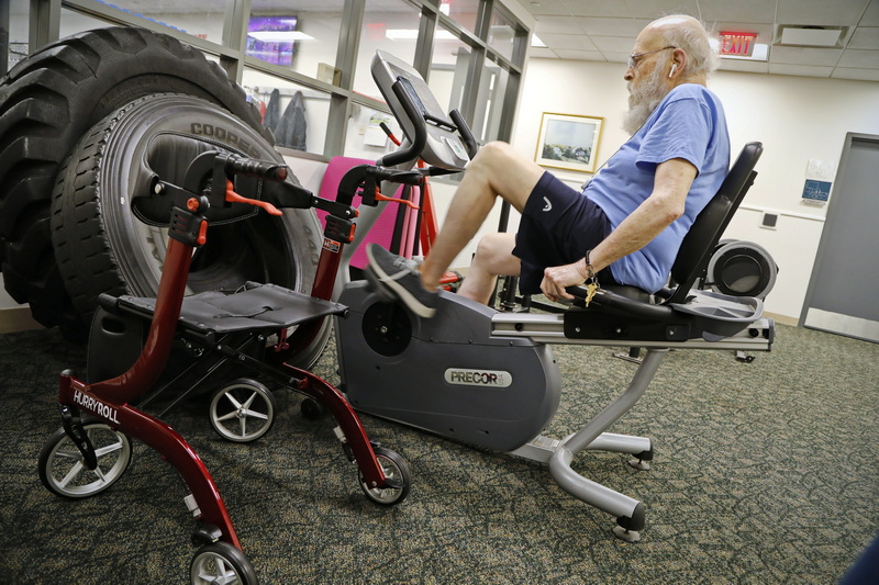 Donald Douglas, 88, works out on the stationary recumbent bicycle at Lightweights Personal Training facility in New Bedford, MA.  Next to him his walker ready for when he is done.  PHOTO PETER PEREIRA