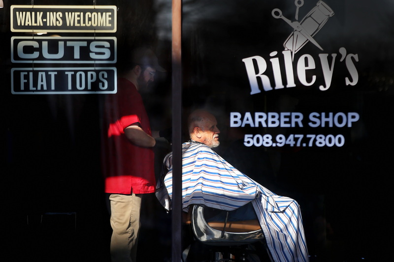 A man gets a haircut at Riley's Barber Shop in Middleboro, MA.  PHOTO PETER PEREIRA