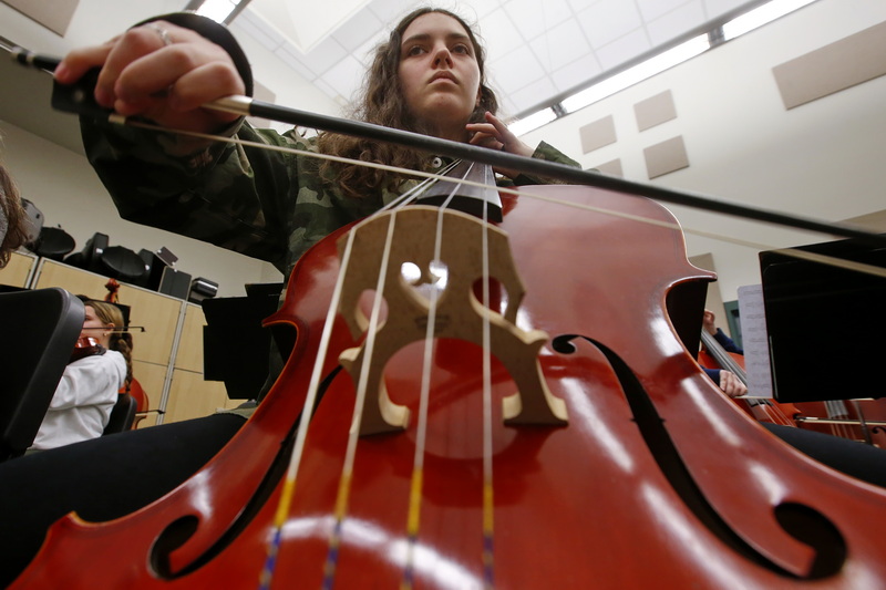 Dartmouth High School Orchestra celloist, Cynthia Scott, 17, practices a composition written by Soon Hee Newbold, who is visiting their school.  PHOTO PETER PEREIRA