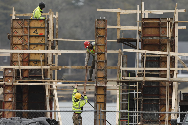 Workers install the forms for the new Harborbaster and Marine Center being constructed in Marion, MA. PHOTO PETER PEREIRA