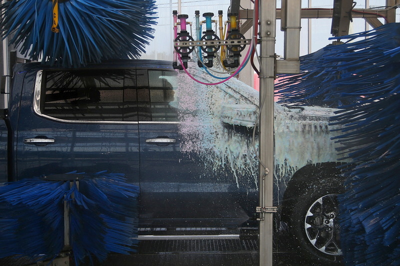 A man is seen inside his pickup truck as he takes it for a car wash at the recently opened Regency Car Wash on Route 6 in Wareham, MA. PHOTO PETER PEREIRA