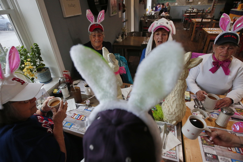 (clockwise) Retired Westport school teachers, Paula Sullivan, Nancy Raczka, Ingrid Gary, Muriel Croft and Maddie Gonsalves don their Easter bunny head gear for their weekly breakfast at Lolly's Restaurant in Dartmouth, MA.  They call themselves the Breakfast Bunch and get together every Thursday morning for breakfast. PHOTO PETER PEREIRA