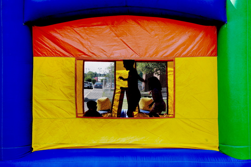 Children play inside the bounce house as part of the Fun Friday at Camp Frederick Douglass at the YMCA in New Bedford, MA  PHOTO PETER PEREIRA