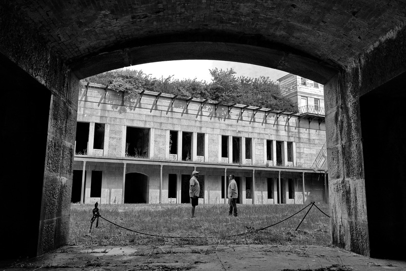 Mike Neves, Park Manager and James Sylvia, assistant director facilities and fleet management, take in the inside of Fort Rodman during a tour to evaluate the condition of the Civil War era fort located at Fort Taber Park in New Bedford, MA. PHOTO PETER PEREIRA