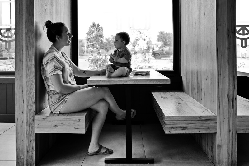 Lexi Malloy and her one year old son, Connolly Malloy, enjoy a moment together in one of the booths of Ground Floor Coffee in New Bedford, MA. PHOTO PETER PEREIRA