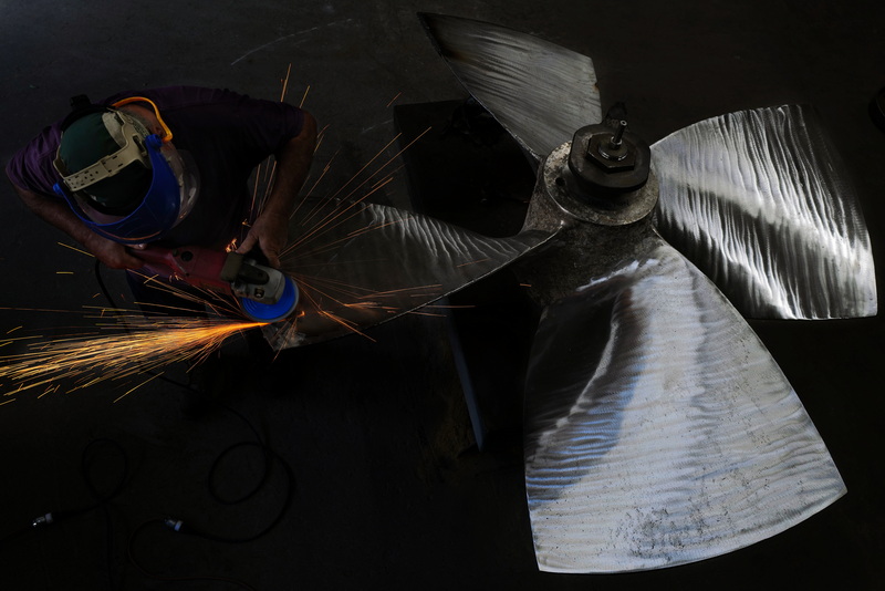 John DeMello, propeller technician at Scandia in Fairhaven, MA sends sparks flying as he makes repairs to a stainless steel propeller from a fishing boat. PHOTO PETER PEREIRA