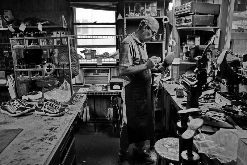 Scott Amorin makes repairs to the heel of a shoe at the New York Shoe Repair on Dartmouth street in New Bedford, MA.  Mr. Amorin is the last cobbler in the SouthCoast and will celebrate forty five years being open this year. PHOTO PETER PEREIRA