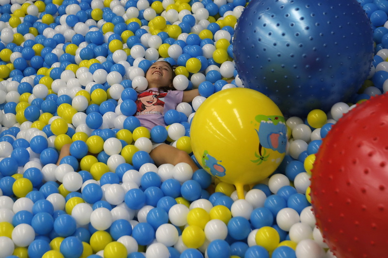 Mariah Cote, 7, jumps into the ball pit at the just opened Hyperzone indoor playground at the Dartmouth Mall in Dartmouth, MA. PHOTO PETER PEREIRA