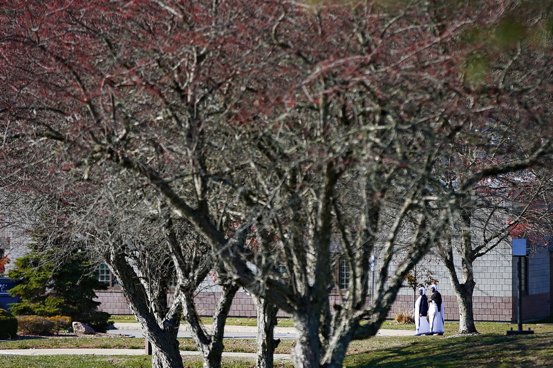 Two sisters of the Missionaries of Charity make their way across the grounds of the Bristol County House of Correction in Dartmouth, MA. PHOTO PETER PEREIRA