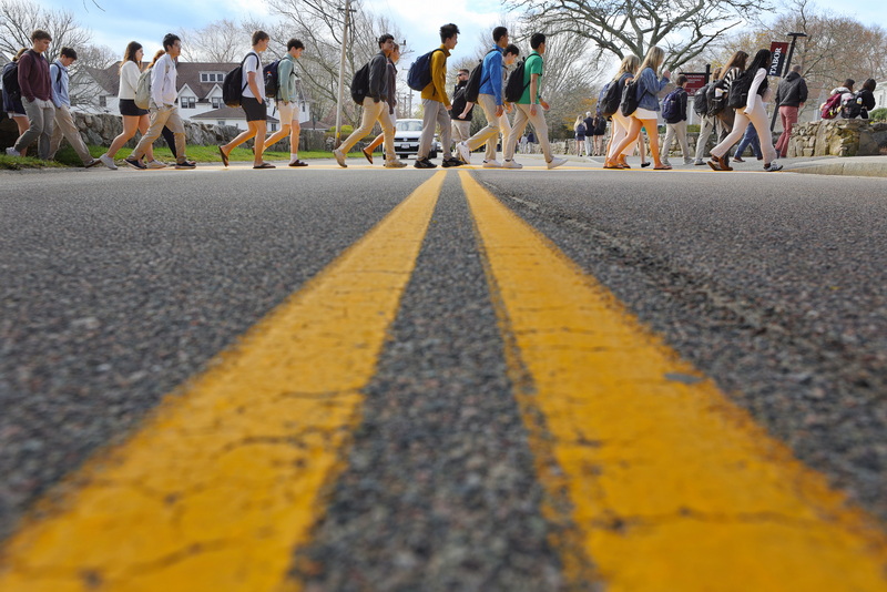 Students from Tabor Academy cross Spring Street in Marion following their bi-weekly 'Chapel Program,' during which a student addresses the whole student body on a topic before classes start. PHOTO PETER PEREIRA