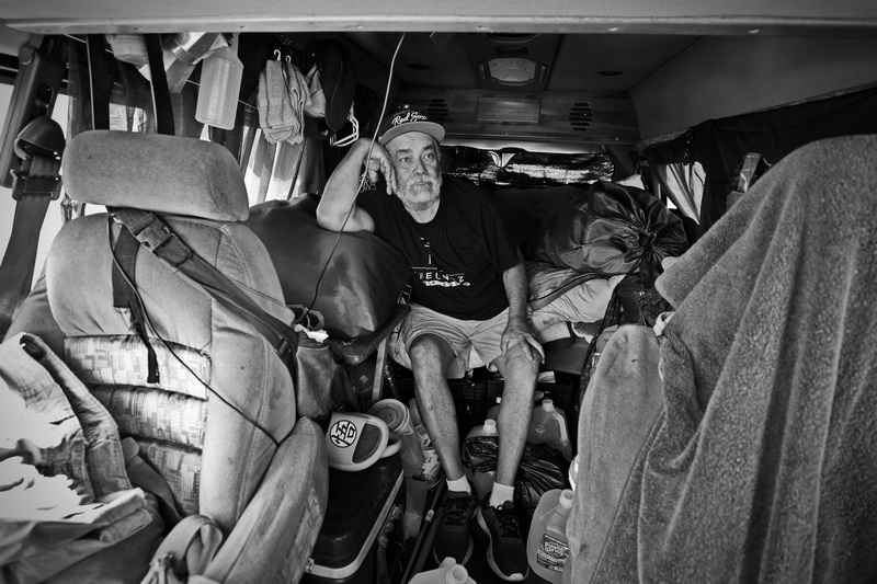 Jorge Lugo is seen in the back of his van which he has been living in since becoming homeless in 2024.  Mr. Lugo is parked in front of West Beach in New Bedford, MA waiting for the bathrooms to be opened so he can wash up. PHOTO PETER PEREIRA