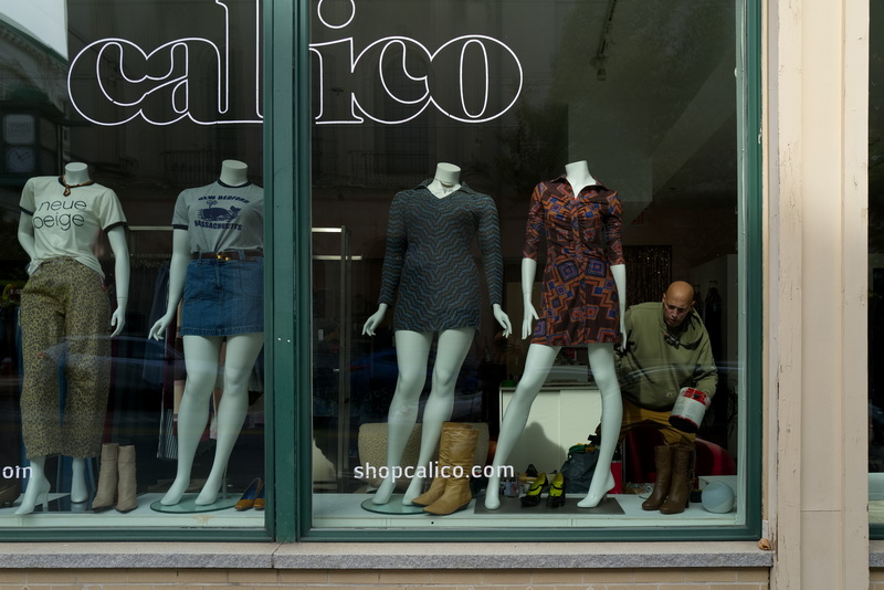 Jayme Tracz is framed by the storefront of Calico on Union Street in New Bedford, MA on October 20, 2026 as he makes changes to the interior layout of the popular downtown new and vintage clothing store. PHOTO PETER PEREIRA