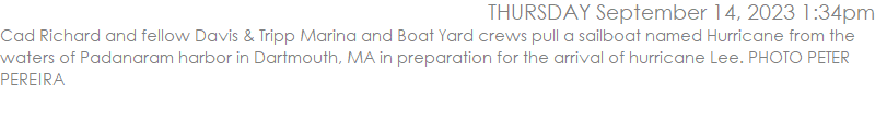 Cad Richard and fellow Davis & Tripp Marina and Boat Yard crews pull a sailboat named Hurricane from the waters of Padanaram harbor in Dartmouth, MA in preparation for the arrival of hurricane Lee. PHOTO PETER PEREIRA