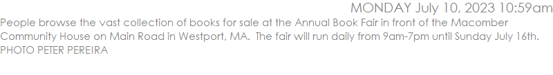 People browse the vast collection of books for sale at the Annual Book Fair in front of the Macomber Community House on Main Road in Westport, MA.  The fair will run daily from 9am-7pm until Sunday July 16th. PHOTO PETER PEREIRA