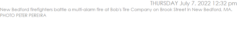 New Bedford firefighters battle a multi-alarm fire at Bob's Tire Company on Brook Street in New Bedford, MA.  PHOTO PETER PEREIRA